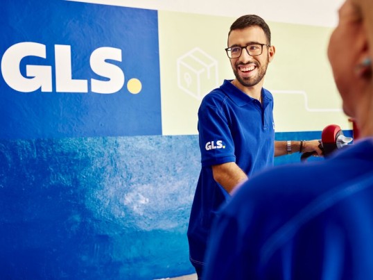 two men with parcels in a warehouse